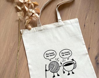 Jute bag with the inscription 'She loves me more!'