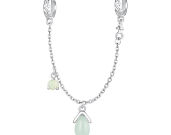 May include: A silver-toned charm bracelet safety chain with two decorative end pieces. The chain features a small, round, pale green gemstone and a larger, teardrop-shaped, pale green gemstone pendant.