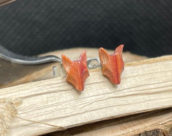 Pair of wolf head earrings in rosewood