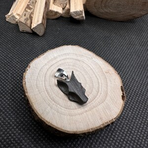 Wolf head pendant made of peat oak wood