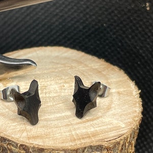 Pair of ebony wood wolf head earrings