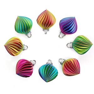 May include: Eight iridescent Christmas baubles in a rainbow of colours, each with a silver loop for hanging.
