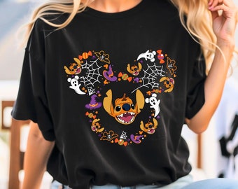 May include: Black t-shirt featuring a Halloween-themed Mickey Mouse design with Stitch sporting a pumpkin head and other Halloween elements such as ghosts, candy, and witch hats.