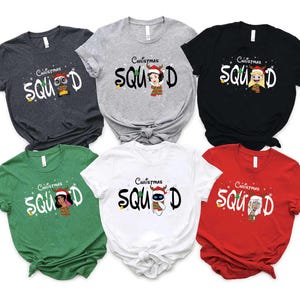 May include: Six different colored t-shirts with the text "Christmas Squad" and a cartoon character wearing a Santa hat. The shirts are in the colors grey, white, black, green, red, and white.