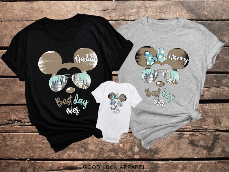 May include: Three t-shirts with a Mickey Mouse design. The shirts say "Daddy", "Mommy", and "Best day ever".