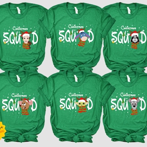 May include: Six green t-shirts with the text "Christmas Squad" and a different cartoon character on each shirt. The characters are Belle, Eeyore, Darth Vader, Mickey Mouse, Yoda, and Pluto.