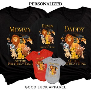 May include: A set of black t-shirts with a Lion King theme. The shirts feature the text "Mommy", "Daddy", and "Kevin" with the Lion King characters. The shirts also include the text "The Birthday King" and "Of the Birthday King".