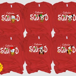 May include: Six red t-shirts with the text "Christmas Squad" and a different Disney character on each shirt. The characters are Mickey Mouse, Minnie Mouse, Donald Duck, Goofy, Pluto, and Daisy Duck.
