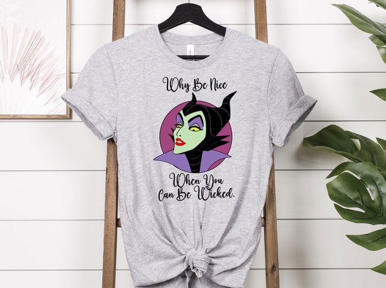 May include: Gray t-shirt with a cartoon image of Maleficent from Disney's Sleeping Beauty. The text "Why Be Nice When You Can Be Wicked." is printed on the shirt.
