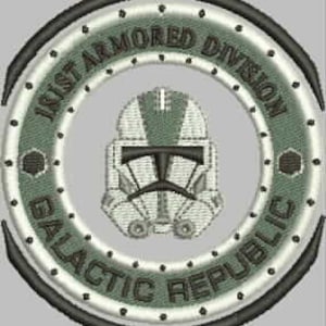 May include: A circular patch with a white and green design. The patch features a white helmet with a green visor and a green and white design on the helmet. The text "101st Armored Division Galactic Republic" is written in a circle around the helmet.