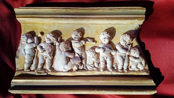 Bas-relief sculpture "Musical Putti" 28 x 43 cm 2018 by Elena Karamushka