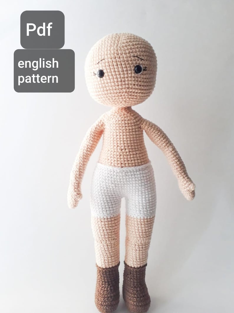 May include: Crochet doll pattern in PDF format. The pattern is in English. The doll is nude with white crocheted shorts and brown crocheted boots.