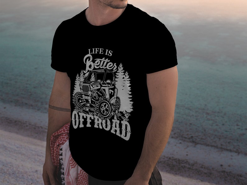 May include: A black t-shirt with a white graphic design featuring an off-road vehicle and the text "Life is Better Offroad".