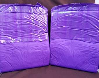 May include: Two purple adult diapers with a plastic outer layer and a smooth inner layer.
