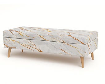 May include: A rectangular storage bench with a white marble-patterned top and gold veining. The bench has light-colored wooden legs. The design is modern and suitable for various interior styles.