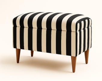 May include: A rectangular storage ottoman with a black and cream striped pattern. The ottoman has a cushioned top and is supported by four wooden, tapered legs. The design is a classic, modern style.
