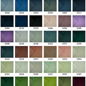 Pode incluir: Uma carta de cores com 36 amostras de tecido em v&aacute;rios tons de verde, marrom, azul, roxo, vermelho e amarelo. As amostras est&atilde;o dispostas em uma grade e etiquetadas com n&uacute;meros de 2201 a 2259. A carta &eacute; intitulada "MAGIC VELVET".