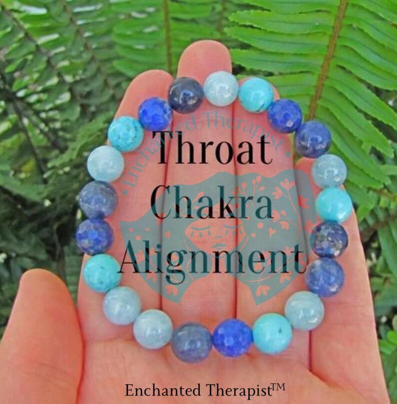 May include: A blue and turquoise gemstone bracelet with the text "Throat Chakra Alignment" on a hand.