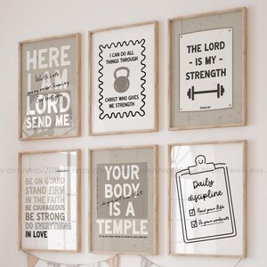 May include: Six framed inspirational wall art prints with text in black and white. The prints include phrases like "The Lord is my strength" and "Your body is a temple." The frames are a light brown color.