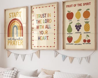 May include: Three framed art prints with inspirational quotes and illustrations. The first print says "START each day with a PRAYER" with a rainbow. The second print says "TRUST IN THE LORD WITH ALL YOUR HEART." The third print is titled "FRUIT OF THE SPIRIT."