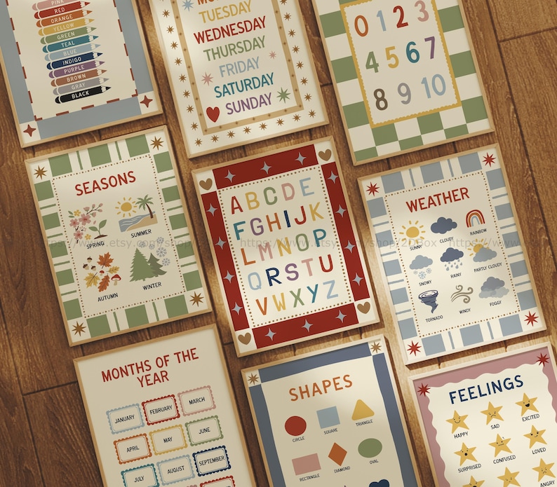 May include: A collection of educational posters with various themes, including the alphabet, numbers, seasons, weather, shapes, and feelings. Each poster features colorful designs and clear text, perfect for learning. The posters are arranged on a wooden surface.