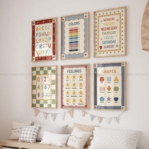 May include: A collection of framed educational posters for a child's room. The posters display the alphabet, colors, days of the week, numbers, feelings, and shapes. The posters are in a variety of colors and have a vintage aesthetic.