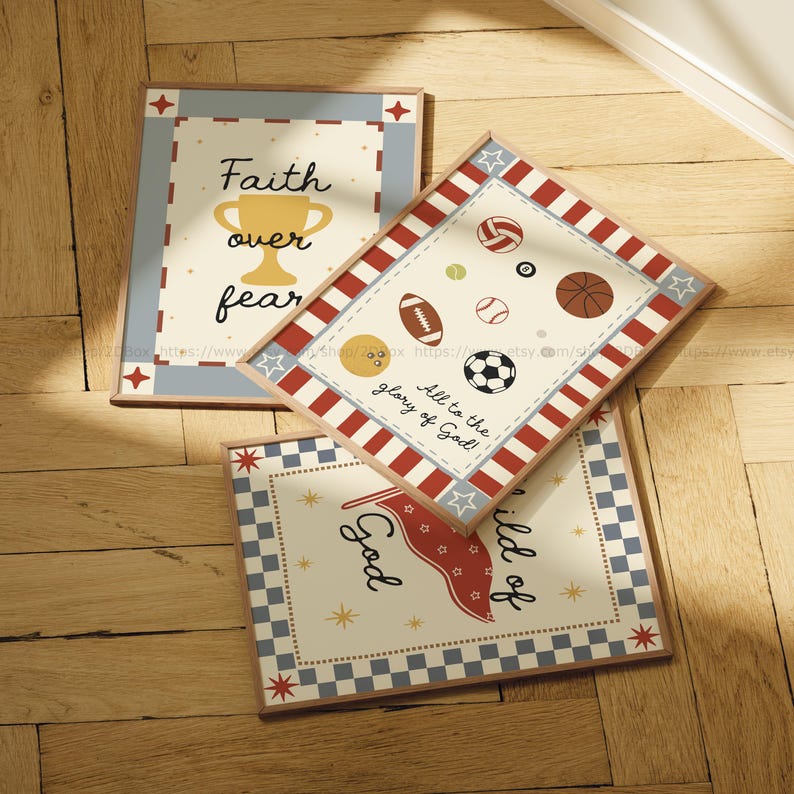 May include: Three framed art prints with inspirational quotes and sports-themed illustrations. One print reads "Faith over fear" with a trophy graphic. Another features various sports balls and the text "All to the glory of God!". The third print has a flag graphic.