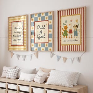 May include: Three framed art prints with inspirational quotes and illustrations. The first print has the text "This is the day the Lord has made." The second print says "Child of God." The third print says "Love one another."