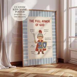 May include: A framed poster with a blue and gold border features a cartoon illustration of a child in armour. The text reads "THE FULL ARMOR OF GOD" with labeled parts. The poster includes the text "CUSTOM KIDS NAME POSTER (WRITTEN ON THE HELMET)".
