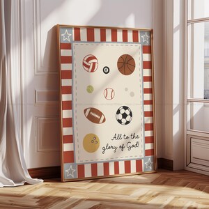 May include: Framed print featuring various sports balls, including a volleyball, basketball, tennis ball, baseball, football, soccer ball, and bowling ball. The print has a red and white striped border with stars and the text "All to the glory of God!"