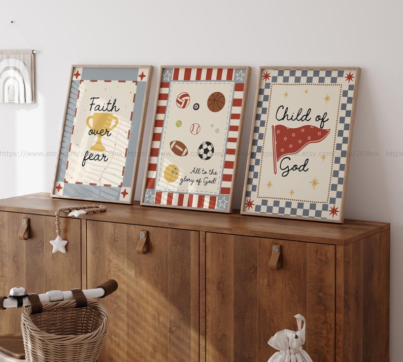 May include: Three framed prints with inspirational messages. The first print says "Faith over fear" with a gold trophy. The second print has sports balls and says "All to the glory of God". The third print says "Child of God" with a red flag.