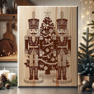 A wooden board with a detailed illustration of two nutcracker men standing in front of a Christmas tree, surrounded by ornaments and other holiday decorations.