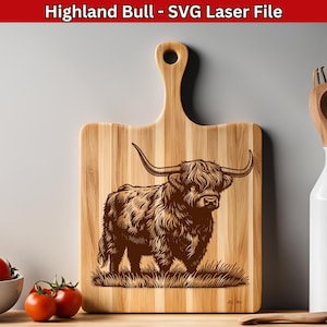May include: A wooden cutting board with a laser-engraved design of a Highland bull. The bull is brown and has long, shaggy hair. The cutting board is rectangular with a handle on the top.