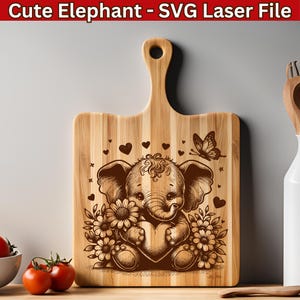 May include: Wooden cutting board with a handle, featuring a laser-etched design of a cute elephant holding a heart, surrounded by flowers and hearts. The text "Cute Elephant - SVG Laser File" is at the top.
