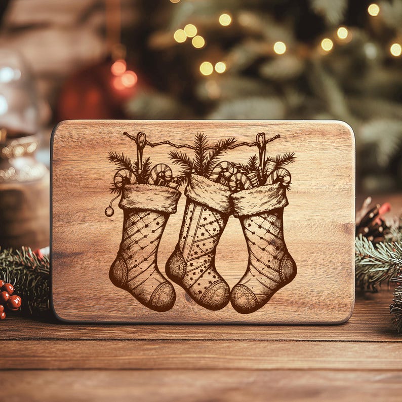 May include: A wooden cutting board with a laser-etched design of three Christmas stockings filled with candy canes and pine branches. The stockings are hanging from a string, and the board has a natural wood grain finish.