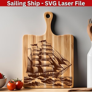 May include: A wooden chopping board with a laser-engraved image of a sailing ship with multiple sails. The ship is sailing on a wavy sea. The chopping board is a light brown colour.