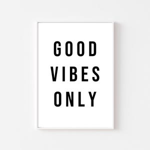 May include: White framed print with black text that reads "GOOD VIBES ONLY".
