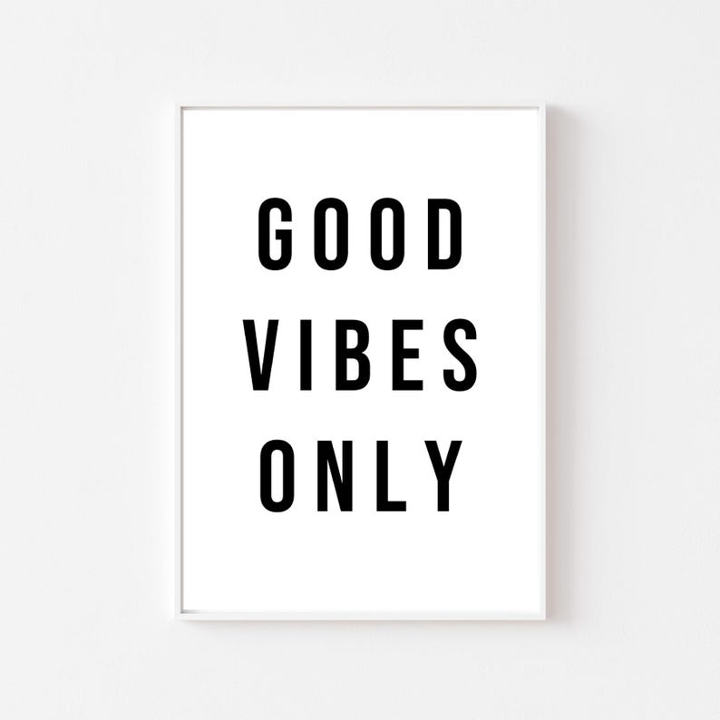 May include: White framed print with black text that reads "GOOD VIBES ONLY".