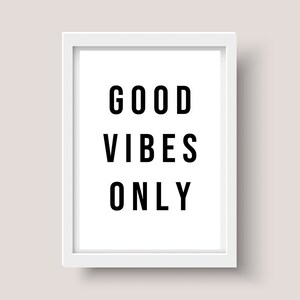 May include: White framed print with the text "GOOD VIBES ONLY" in black.