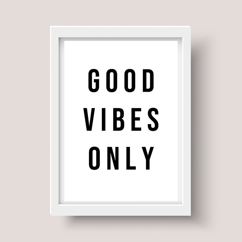May include: White framed print with the text "GOOD VIBES ONLY" in black.