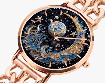 May include: A rose gold wristwatch with a black face featuring a detailed quilling design of a crescent moon, stars, and a planet. The watch has a chain link band.