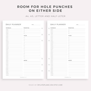 May include: Two blank daily planner pages with space for hole punches on either side. The pages are labeled "Daily Planner" and have sections for "Schedule", "Priorities", "To Do", and "Notes".