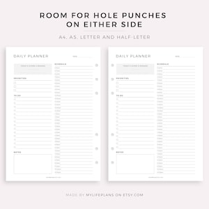 May include: Two printable daily planner pages with space for hole punches on either side. The pages are designed for A4, A5, Letter and Half-Letter sizes. Each page includes sections for "Today's Score & Reward", "Priorities", "To Do", "Schedule", and "Notes".