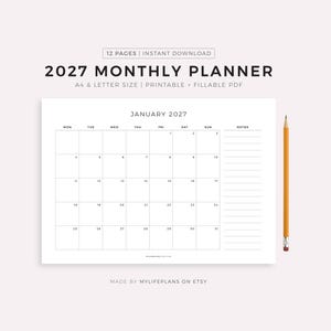 May include: A white 2027 monthly planner with a calendar grid for January. The planner includes space for notes and is accompanied by a yellow pencil. Text on the planner reads "12 PAGES | INSTANT DOWNLOAD" and "A4 & LETTER SIZE | PRINTABLE + FILLABLE PDF."