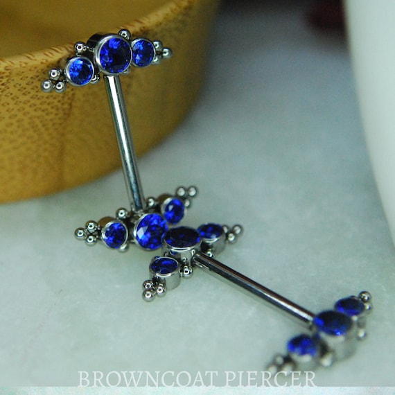 A pair of Titanium Couture Gemmed Nipple Bars - 14ga, Internally threaded barbell, Dark Blue CZ Gems