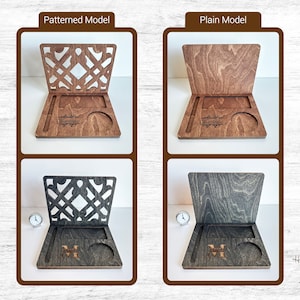 May include: Two wooden phone stands with a cutout design and a small cup holder. The stand on the left has a patterned design and the stand on the right is plain. Both stands have the name "Charlotte" engraved on them.