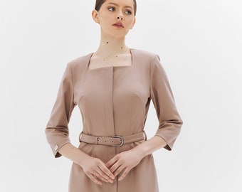 May include: A mauve midi dress with a square neckline and a belt. The dress has a fitted bodice and a slightly flared skirt.