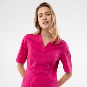 Raspberry women’s scrub outfit with breathable fabric Functional and flattering workwear for nurse doctor aesthetician