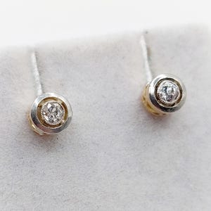 French Art Deco stud earrings 18k gold and platinum set with 0.20 carats of old mine cut diamonds in a bezel setting (circa 1920)