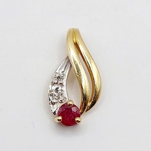 French art nouveau style pendant 18k gold set with a ruby and diamonds in a scroll setting